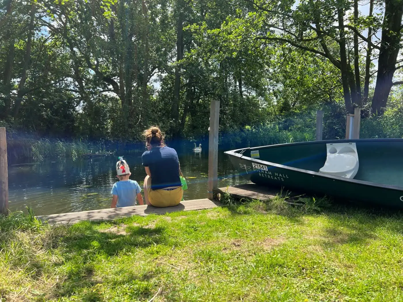 Tents pitched by the water at Canal Camping